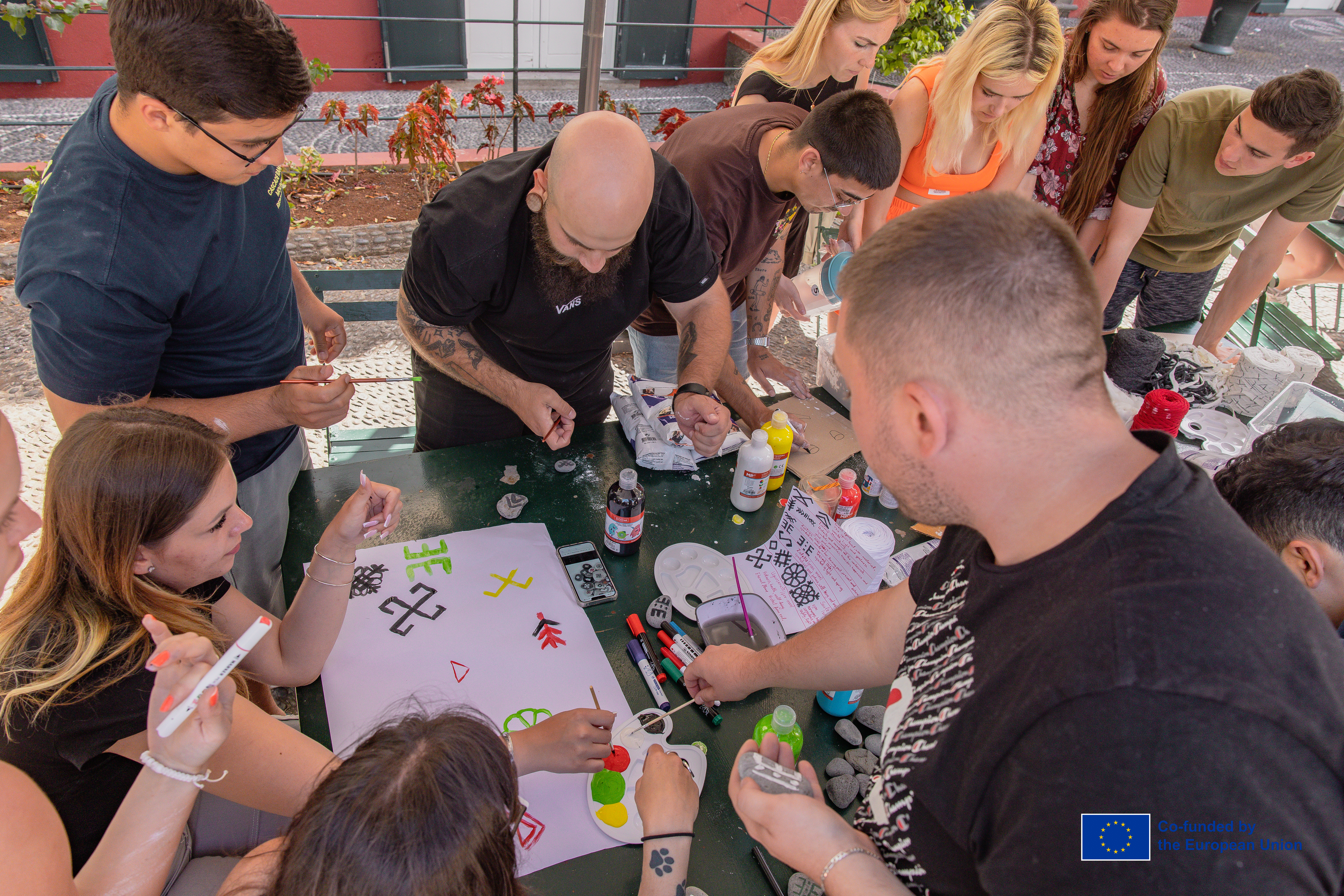 Young people making traditional crafts together at a workshop